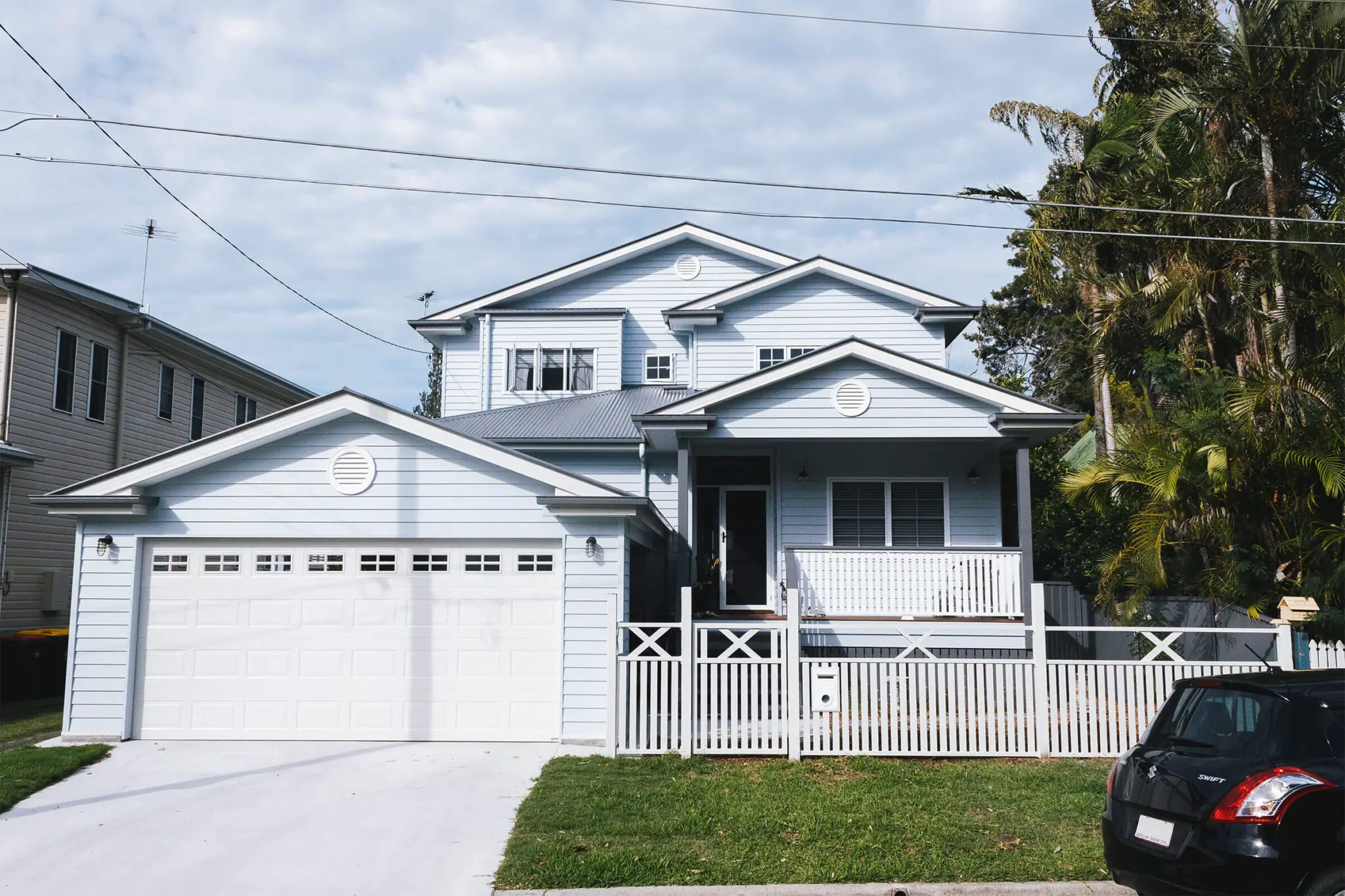 Wood House exterior painted in current colours of grey and white